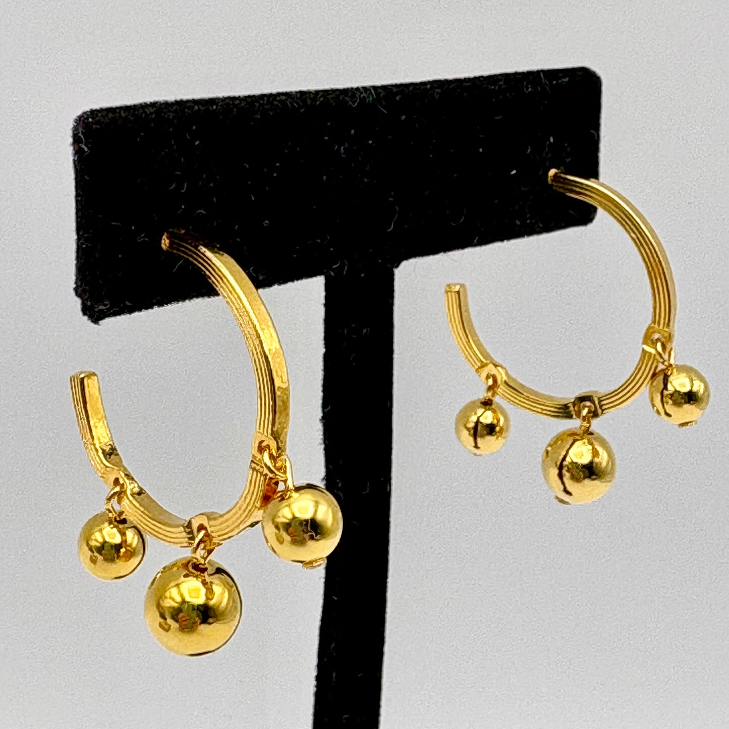 1991 Avon Hoops of Motion Earrings