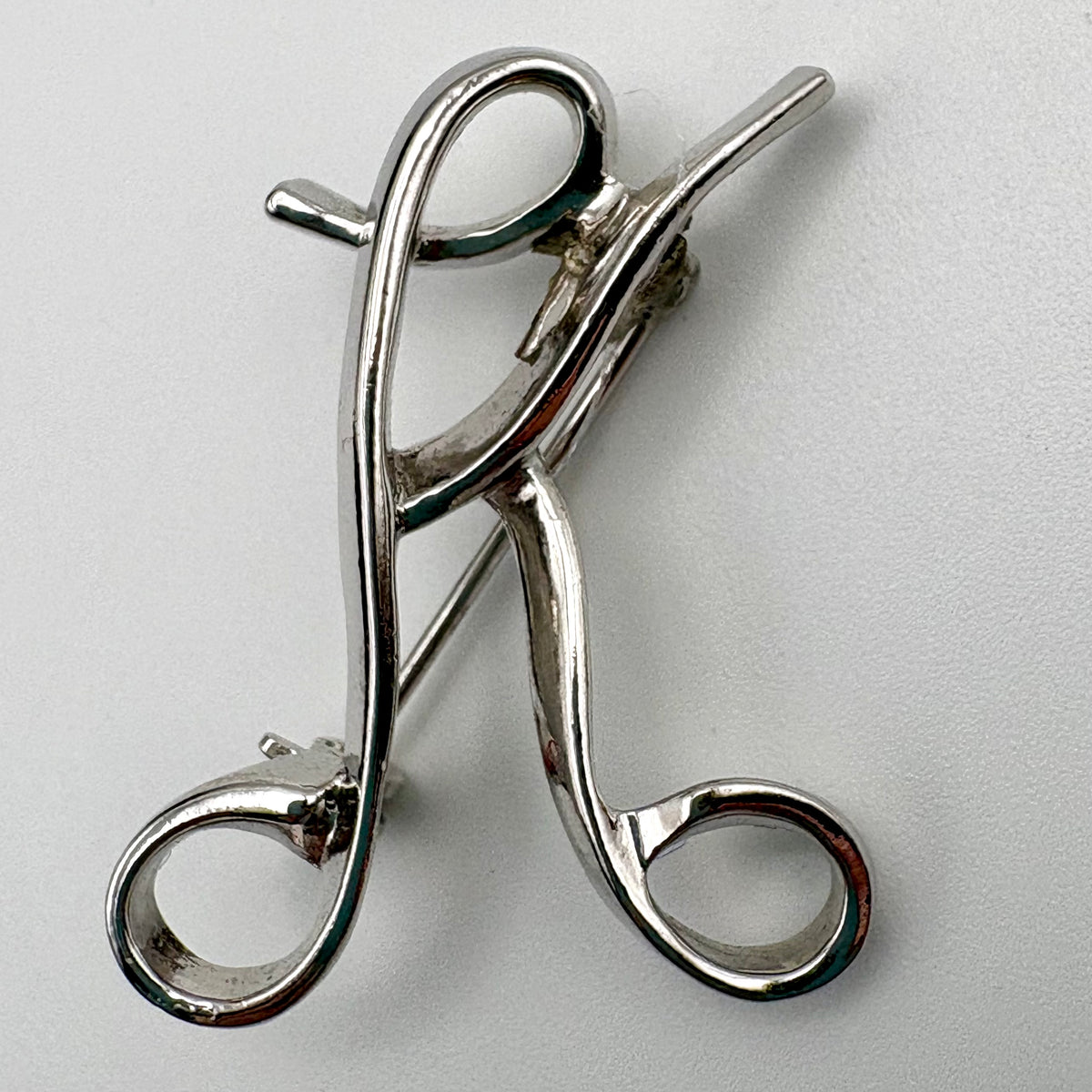 1975 Sarah Coventry Multiple Choice Initial Brooch (Letter K)