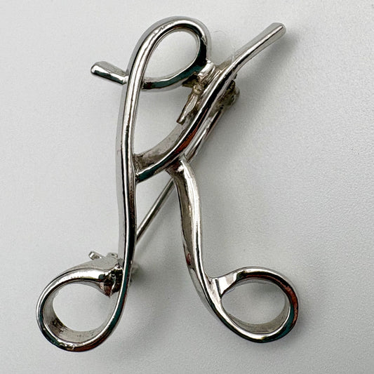 1975 Sarah Coventry Multiple Choice Initial Brooch (Letter K)