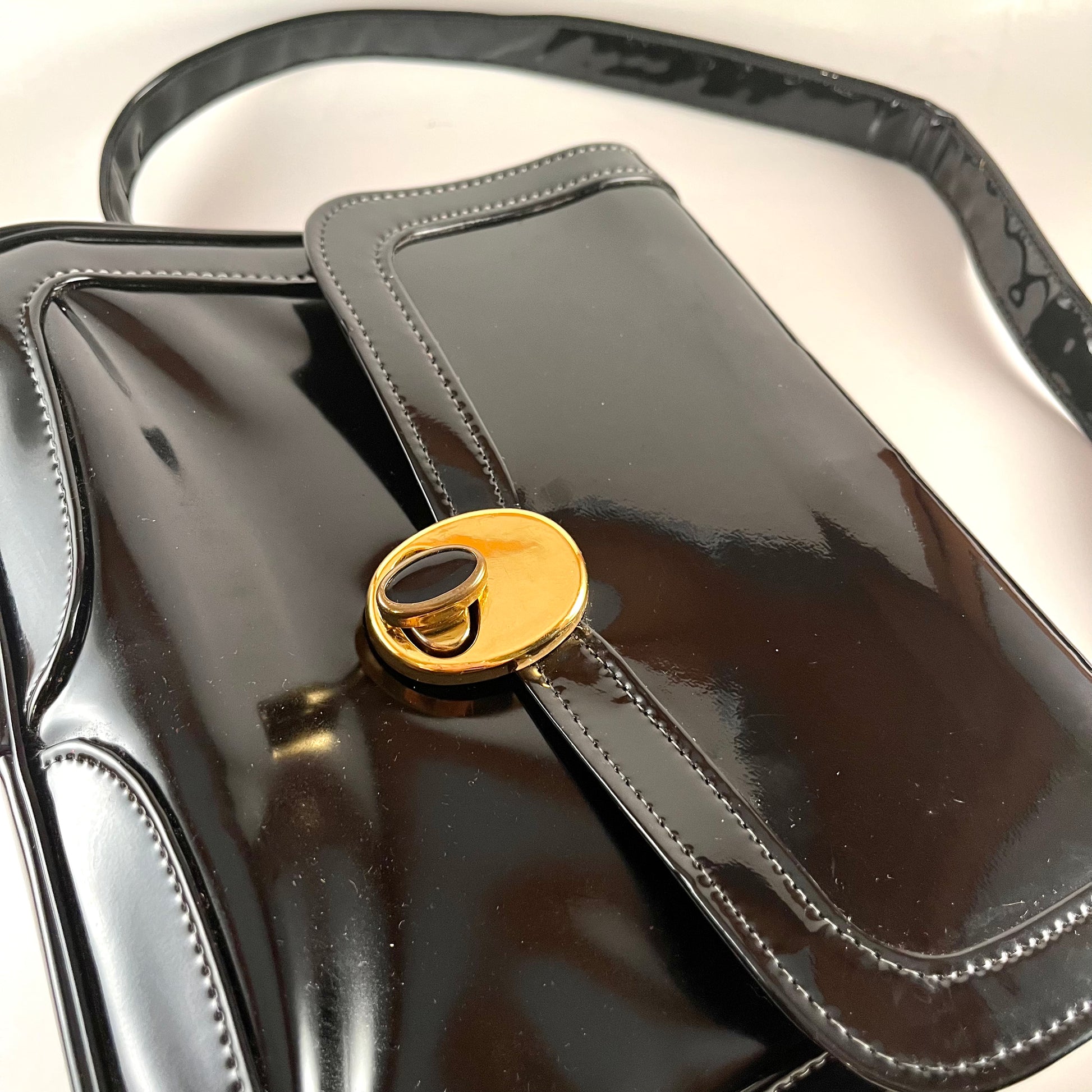 A 1960s Vintage Gucci Black Patent Leather Handbag with Gold Hardware